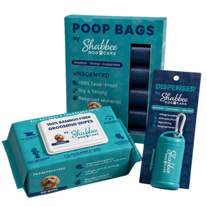 Shabbee Dog Care bundle including a box of unscented 100% bamboo fibre grooming wipes, a  poop bag dispenser, and a roll of dark blue poop bags, shown on a white background.